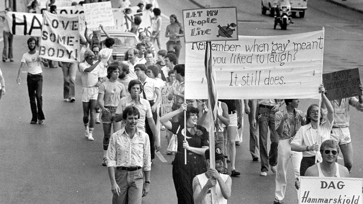 Chanting “We shall overcome,” 250 marchers walk through downtown streets in a Gay Pride Parade, the first of several functions commemo­rating Gay Pride Week June 16-24, 1978.