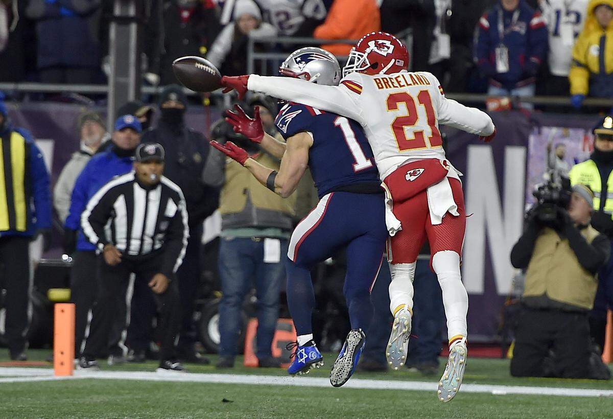 Kansas City Chiefs defensive back Bashaud Breeland (21) breaks up a pass intended for New England Patriots wide receiver Julian Edelman (11), preventing a late-game touchdown during the fourth quarter of the Kansas City Chiefs game against the New England Patriots at Gillette Stadium in Foxborough, Massachusetts, Sunday Dec. 8, 2019. The Chiefs beat the Patriots 23-16.