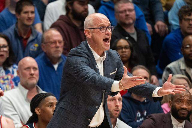UConn Huskies head coach Dan Hurley screams toward the referees in the first half of the game vs. the Kansas Jayhawks on Tuesday, December 2, 2025, at Allen Fieldhouse.
