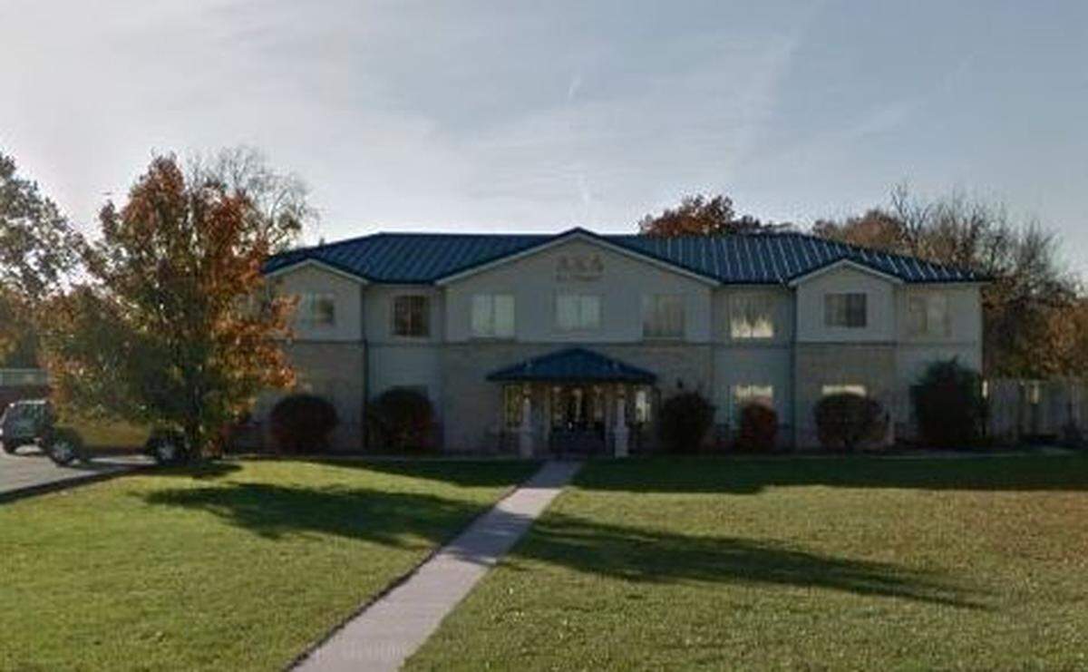 A Google Maps Street View image of the Alpha Kappa Lambda fraternity house, taken in November 2018 near Truman State University in Kirksville, Missouri.