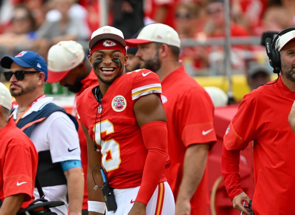 Kansas City Chiefs quarterback Justin Fields (6) is all smiles on the sideline in the Kansas City Chiefs vs. Los Angeles Rams preseason game at Arrowhead Stadium in Kansas City on Aug. 15, 2026.