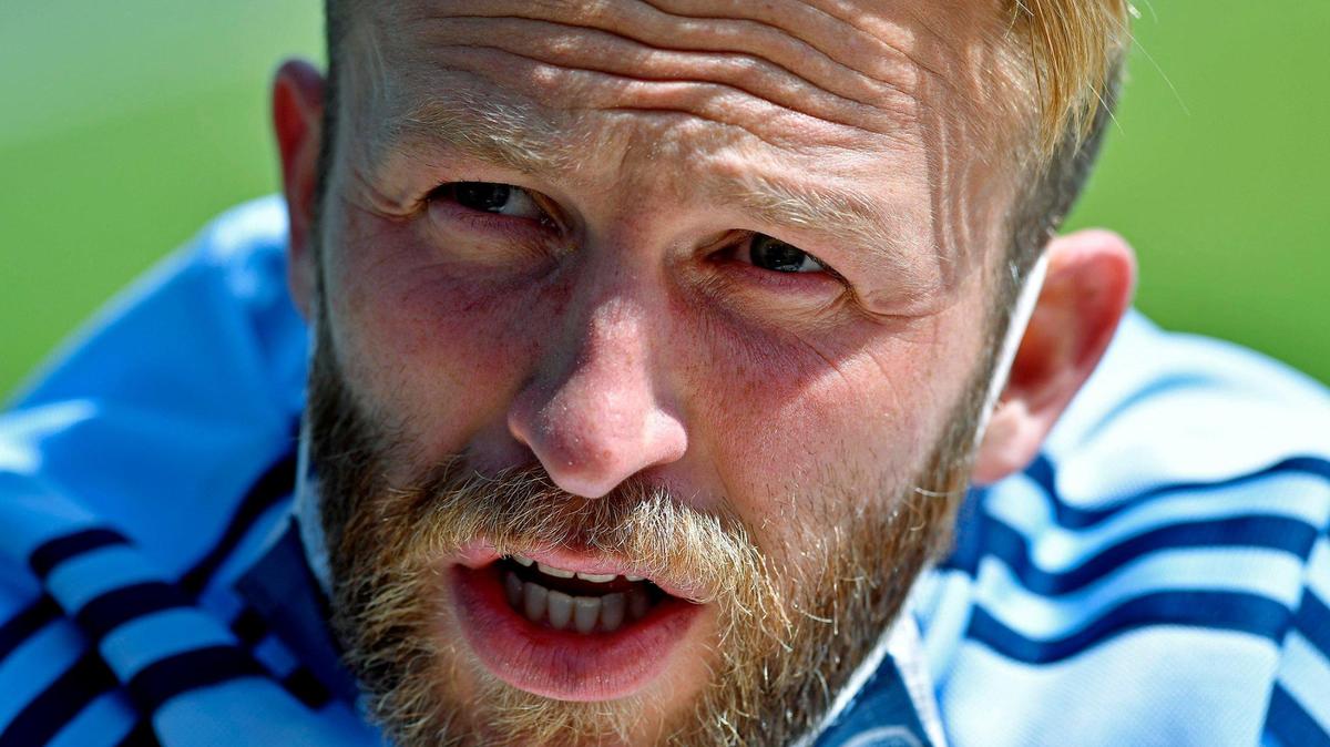 Sporting KC captain Johnny Russell accused a Colorado Rapids player of spitting at SKC teammate Khiry Shelton during a physical preseason match on Saturday.
