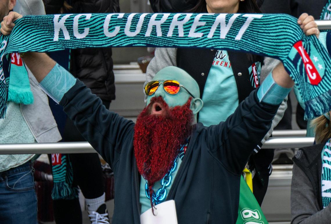 A Kansas City Current fan covered in teal paint and sporting a red beard cheered after the Current defeated the Portland Thorns, 5-4, in the home opener at the new CPKC Stadium on Saturday, March 16, 2024, in Kansas City.
