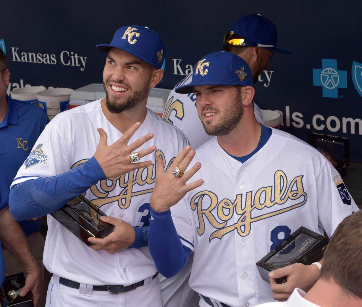 Kansas City Royals first baseman Eric Hosmer (35) and third baseman Mike Moustakas (8) show off their World Series rings before the game against the New York Mets at Kauffman Stadium on April 5, 2016.