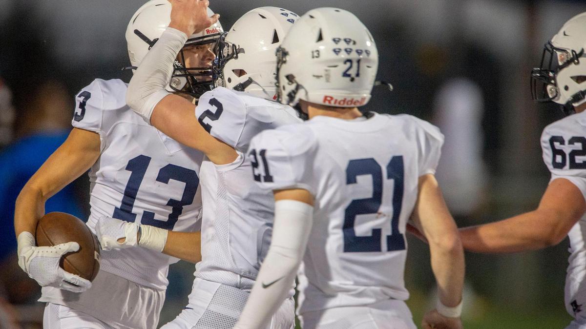Mill Valley Jaguars receiver Tate Nekola (No. 13) celebrates a touchdown with teammates during their win in Gardner Edgerton’s homecoming game at Gardner, Kan.