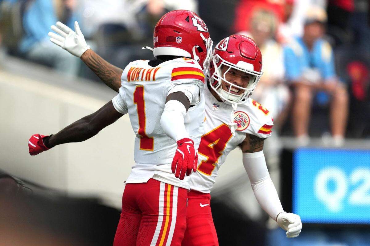 Kansas City Chiefs wide receiver Xavier Worthy (1) celebrates with wide receiver Skyy Moore (24) after catching a 54-yard touchdown pass in the second quarter against the Los Angeles Chargers at SoFi Stadium.