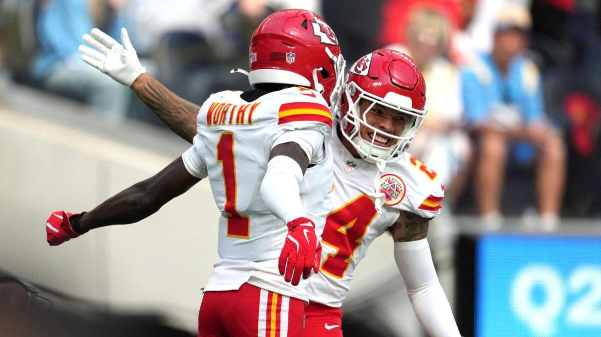 Kansas City Chiefs wide receiver Xavier Worthy (1) celebrates with wide receiver Skyy Moore (24) after catching a 54-yard touchdown pass in the second quarter against the Los Angeles Chargers at SoFi Stadium.