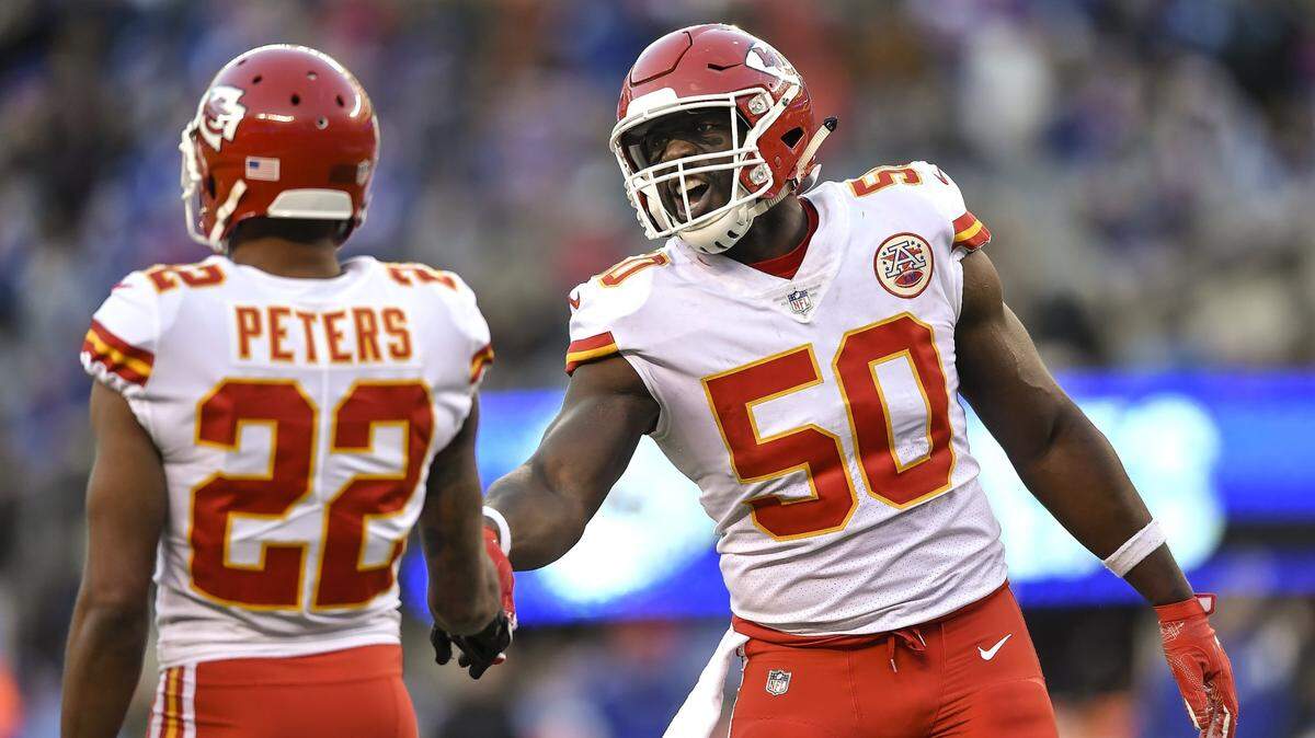 Kansas City Chiefs outside linebacker Justin Houston (50) tried to calm Kansas City Chiefs cornerback Marcus Peters (22) down before the first defensive play following a Chiefs interception against the New York Giants on November 19, 2017 at MetLife Stadium in East Rutherford, New Jersey. The Chiefs lost, 12-9, in overtime.
