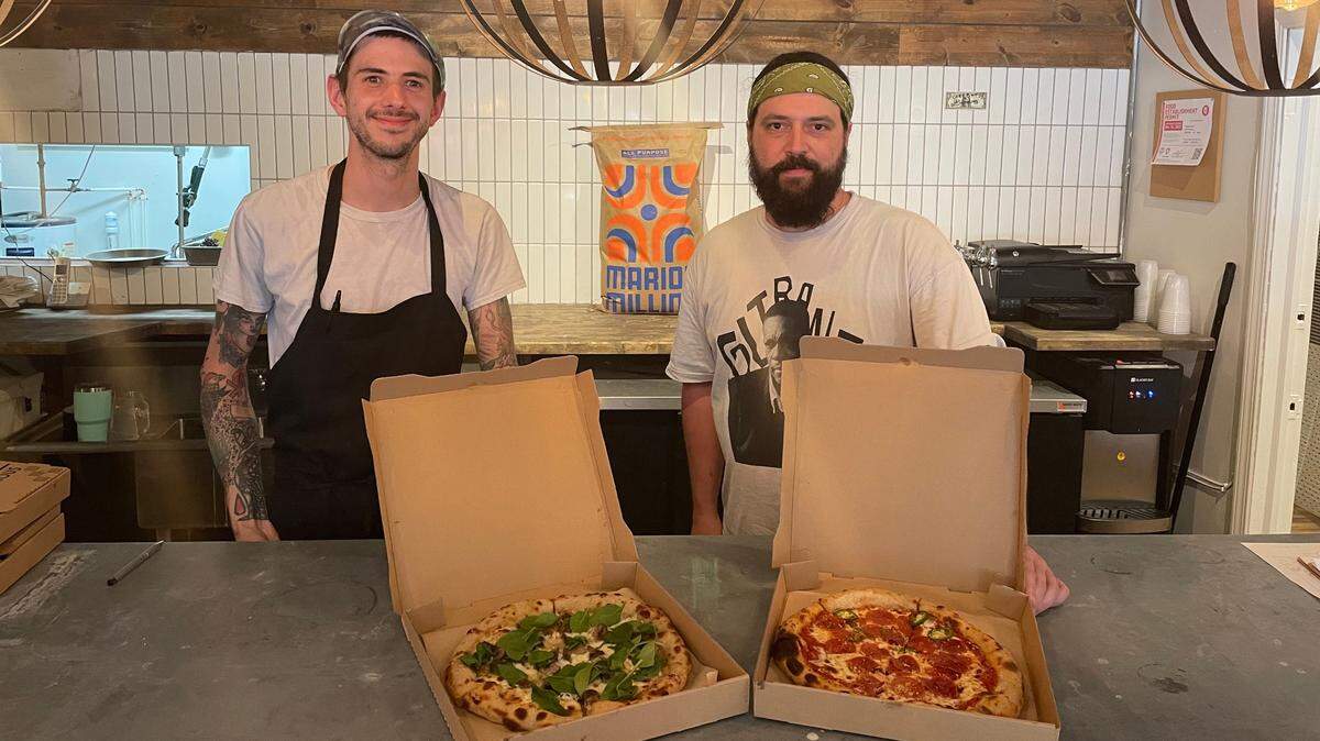 Justin Norcross, right, and Brian Sonnich behind the counter at Fortunati, a pizza joint that opened Wednesday in the West Bottoms.