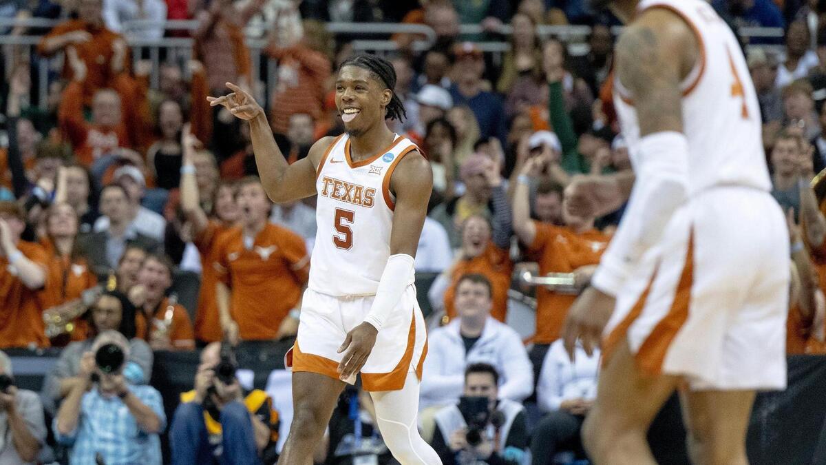 Texas guard Marcus Carr (5) celebrates a 3-pointer against Xavier during a Sweet 16 game in the Midwest Regional of the NCAA Tournament Friday, March 24, 2023, in Kansas City.