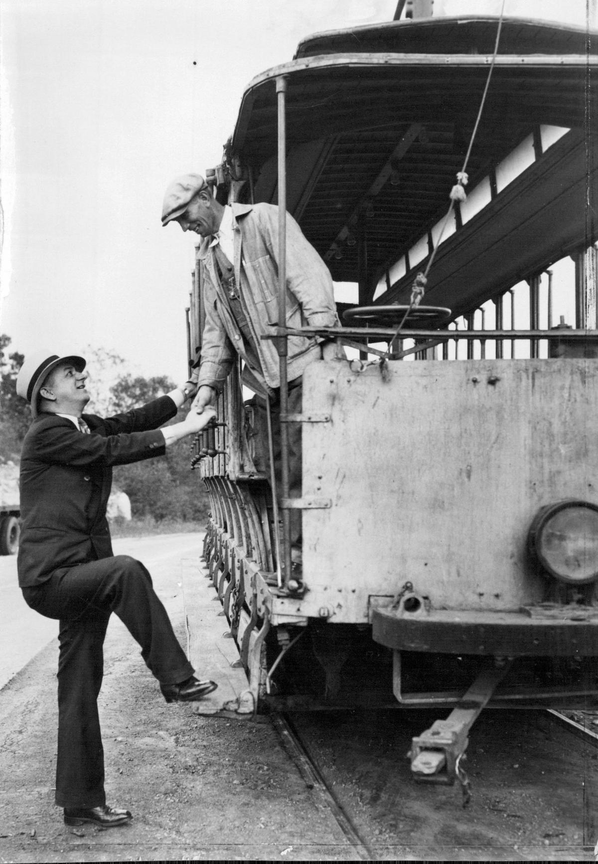The last day of operation in October of 1931 for the “Toonerville trolley,” found James DeWeese bidding Gus Rhodes, long known as “the skipper,” farewell on the car knowns as “Betsy”. DeWeese, who lives one-half mile from the east end of the line, said he bought a motor car two days before in order to have transportation to go to work after the trolley cars had been relegated to the junk pile.
