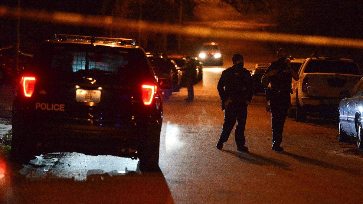 Police investigate a homicide Sunday, Dec. 6, 2020, in the 11300 block of Ditman Avenue in Kansas City.