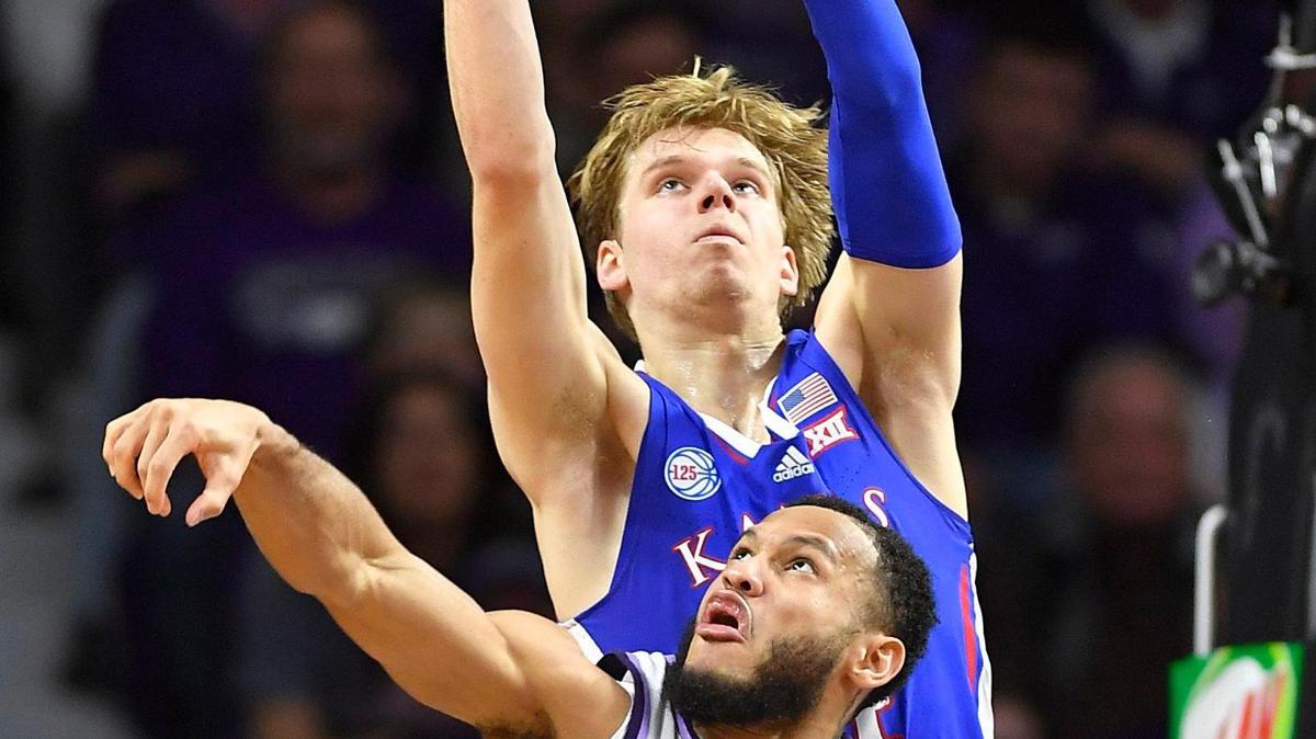 KU’s Gradey Dick catches a pass that was out of the reach of KSU’s Markquis Nowell during the first half of Tuesday night’s Big 12 Conference game at Bramlage Coliseum.