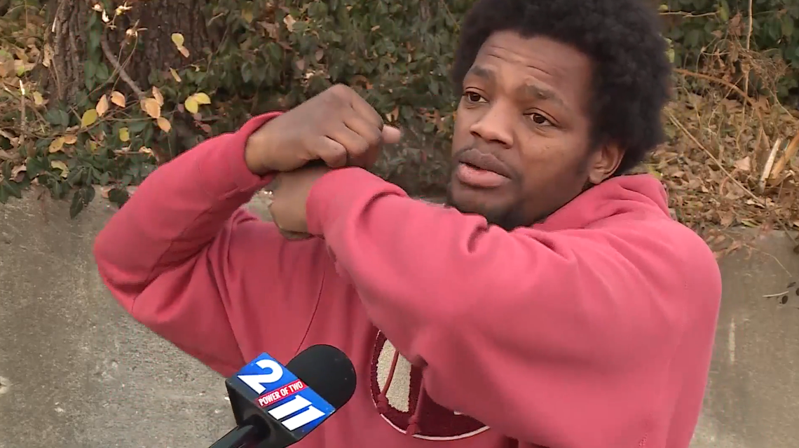 Arnez Merriweather, of St. Louis, demonstrates to media how he helped catch and rescue a 3-year-old girl and her mom from a second-floor apartment during a fire.