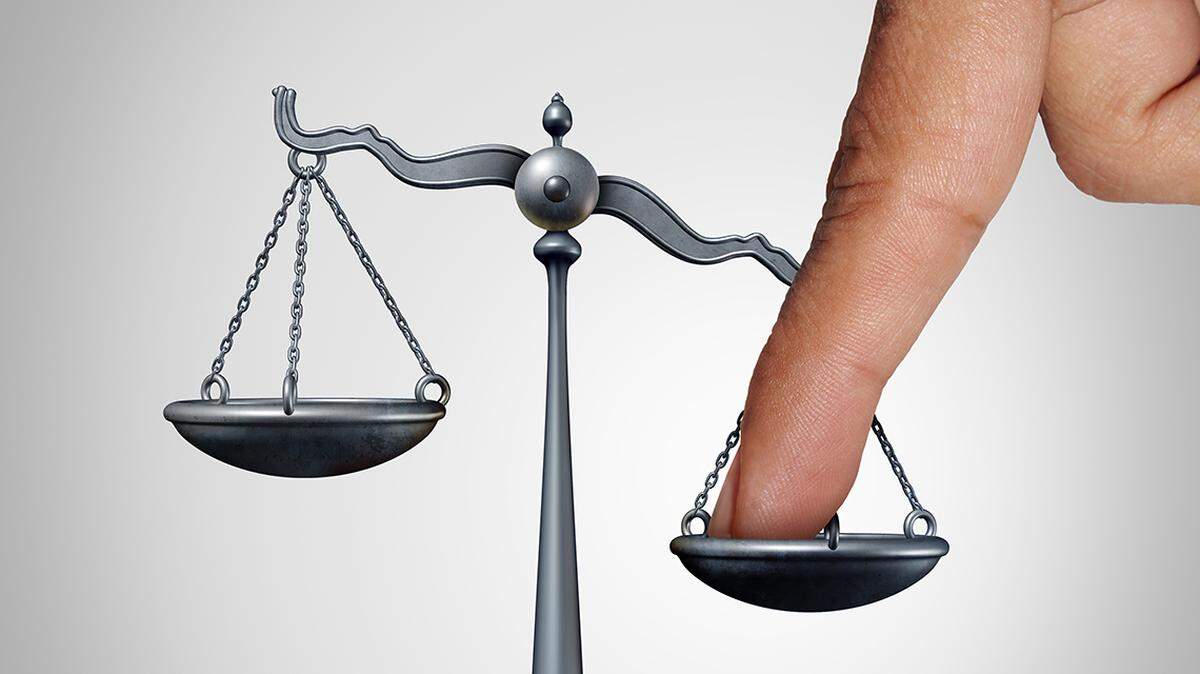 Tip the scales of justice concept as a the finger of a person illegaly influencing the legal system for an unfair advantage with 3D illustration elements.