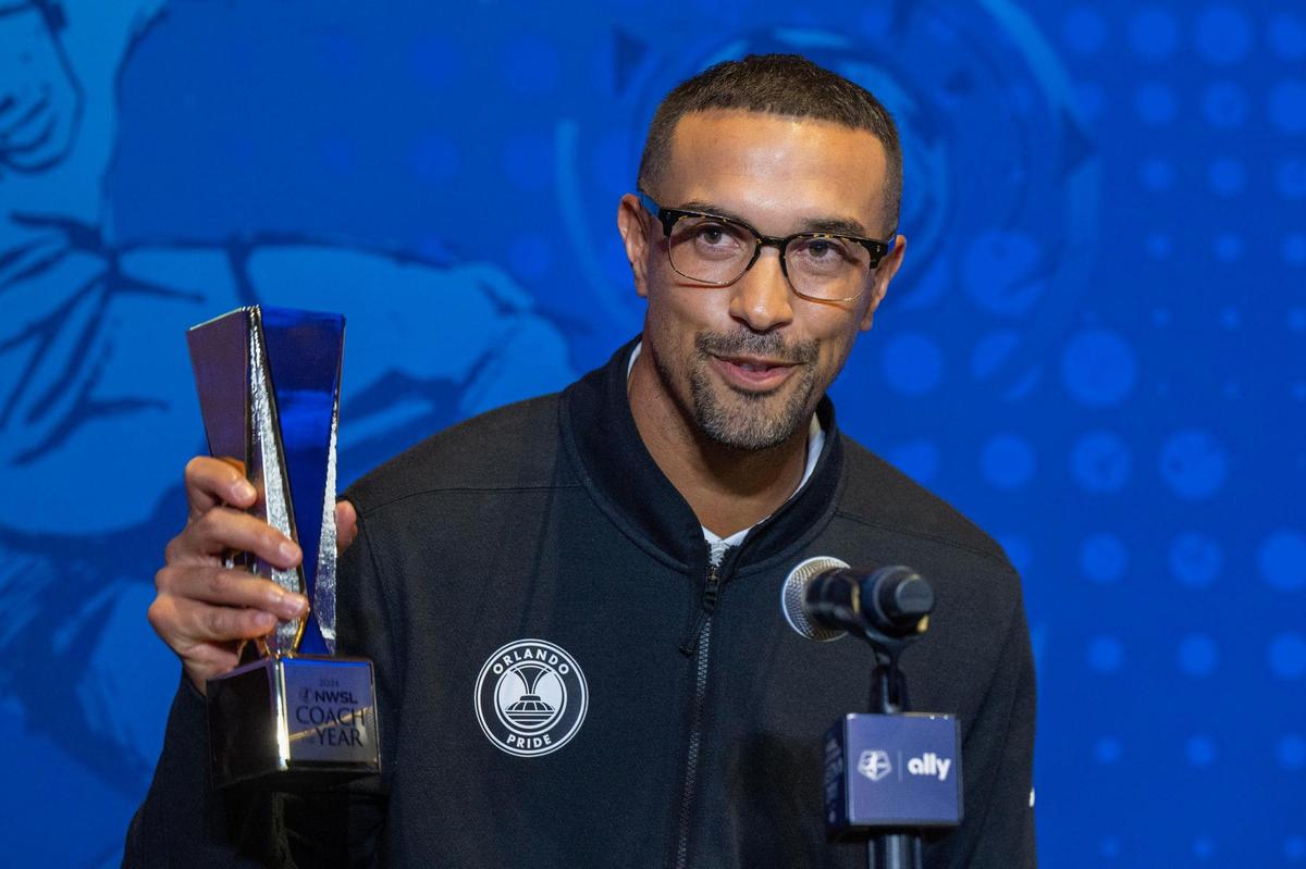 Orlando Pride head coach Seb Hines accepts the NWSL Coach of the Year award during media day for the NWSL Championship at Union Station, Thursday, Nov. 21, 2024, in Kansas City.