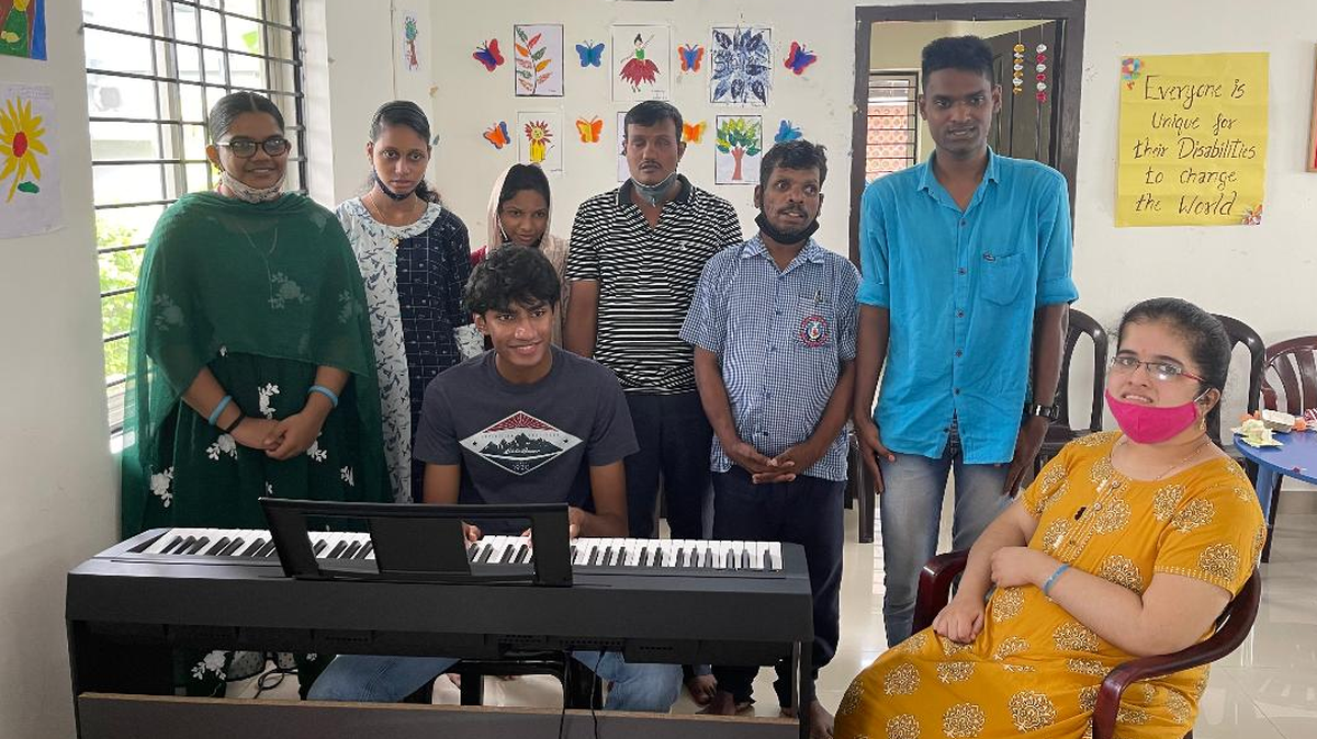 Last summer Aaram Salam, seated at the keyboards, played and taught music each day for a month to a special community in India.. “I was giving them something they didn’t have before,” he said.