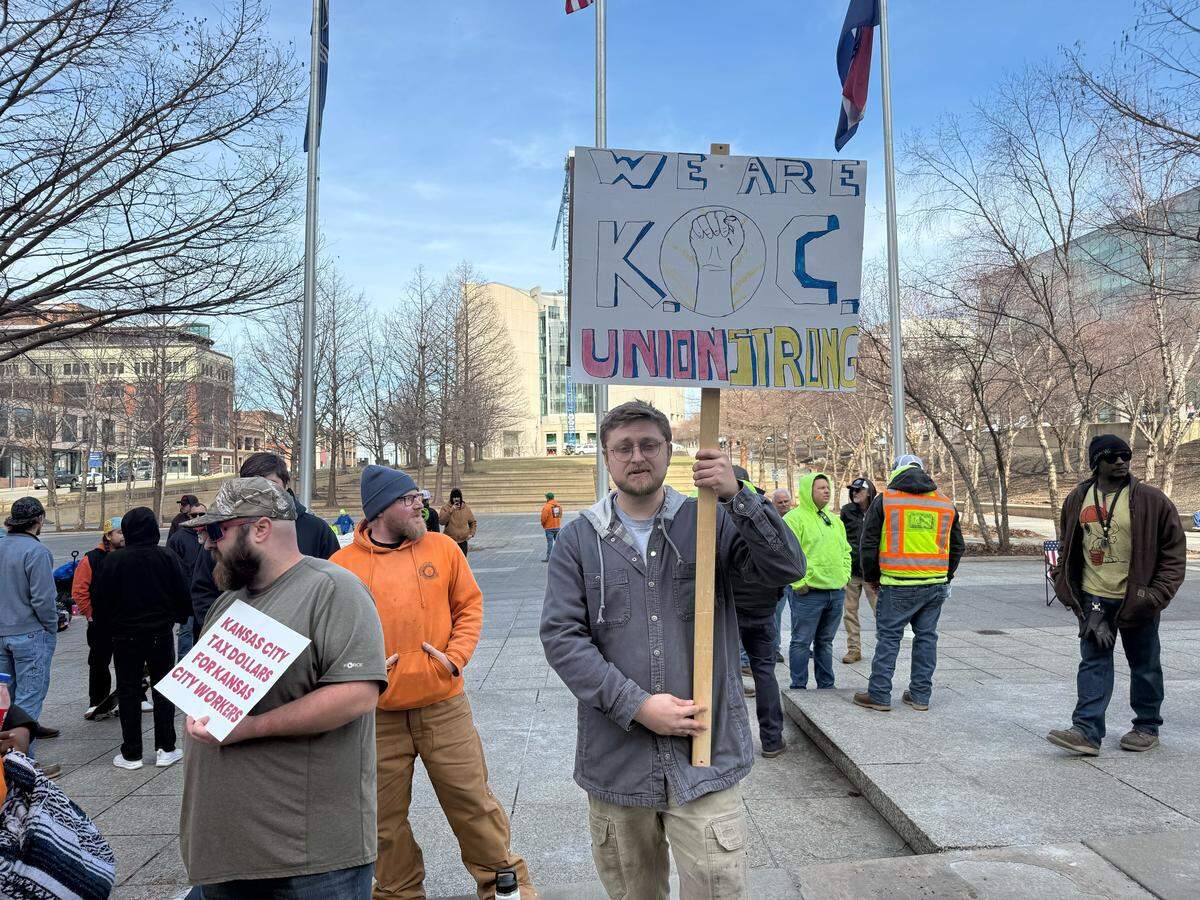 Louis Vanderlinden protests across City Hall, 414 E. 12th St. on Feb. 11, 2026, asking the Kansas City Port Authority to implement fair wages and apprentice requirements on all Port KC projects.