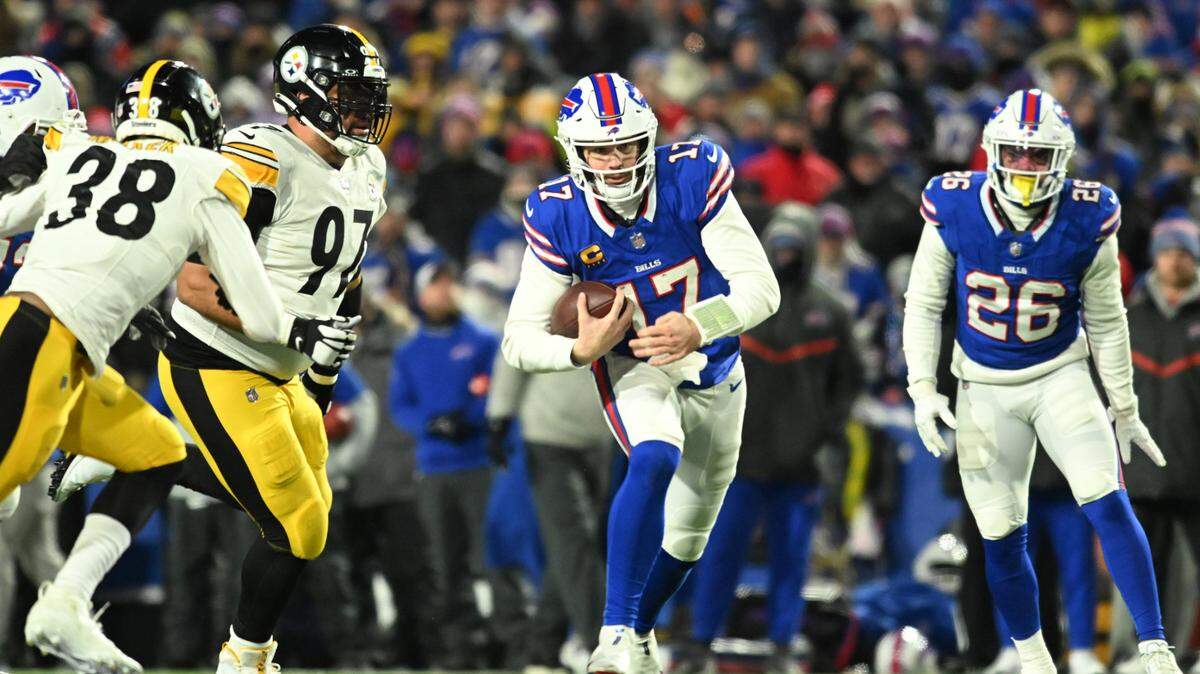 Buffalo Bills quarterback Josh Allen ran the ball in the second half against the Pittsburgh Steelers in an AFC Wild Card game at Highmark Stadium on Monday, Jan. 15, 2024.