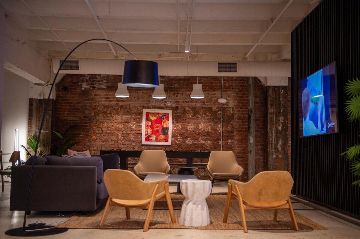 Developers preserved original brick and terrazzo floors in the basement-level lounge.