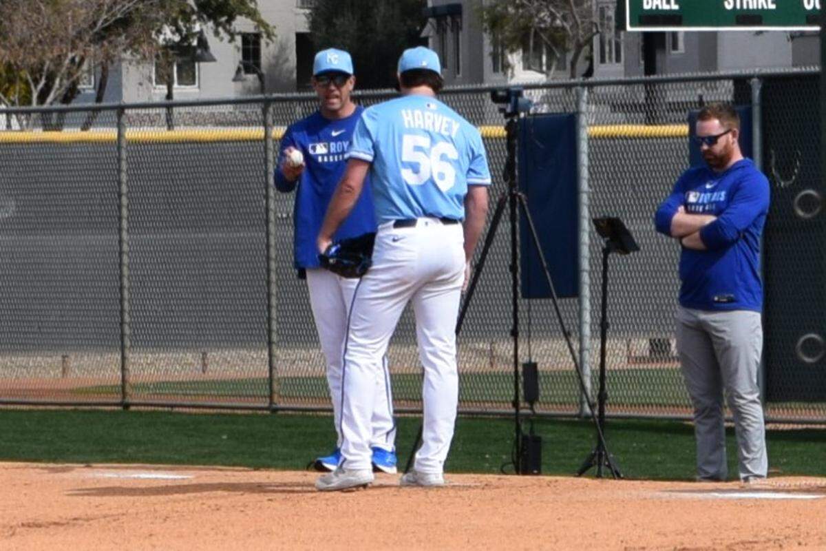 Kansas City Royals reliever Hunter Harvey talks with assistant pitching coach Zach Bove during Sunday’s bullpen session at the club’s spring training complex on Feb. 16.