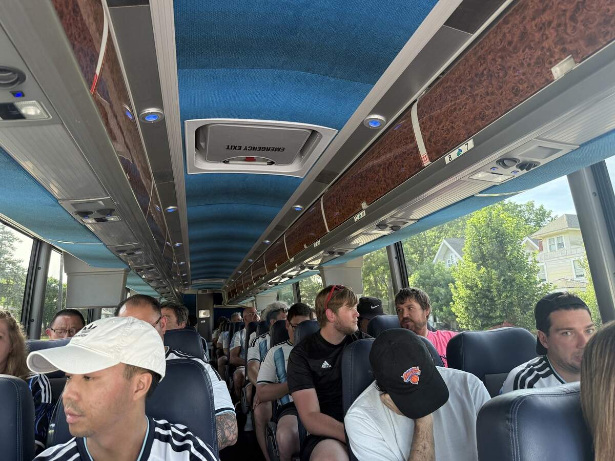 Fans load up a CONNECTKC26 bus ahead of the matchup between Argentina and Algeria at Arrowhead Stadium in Kansas City.