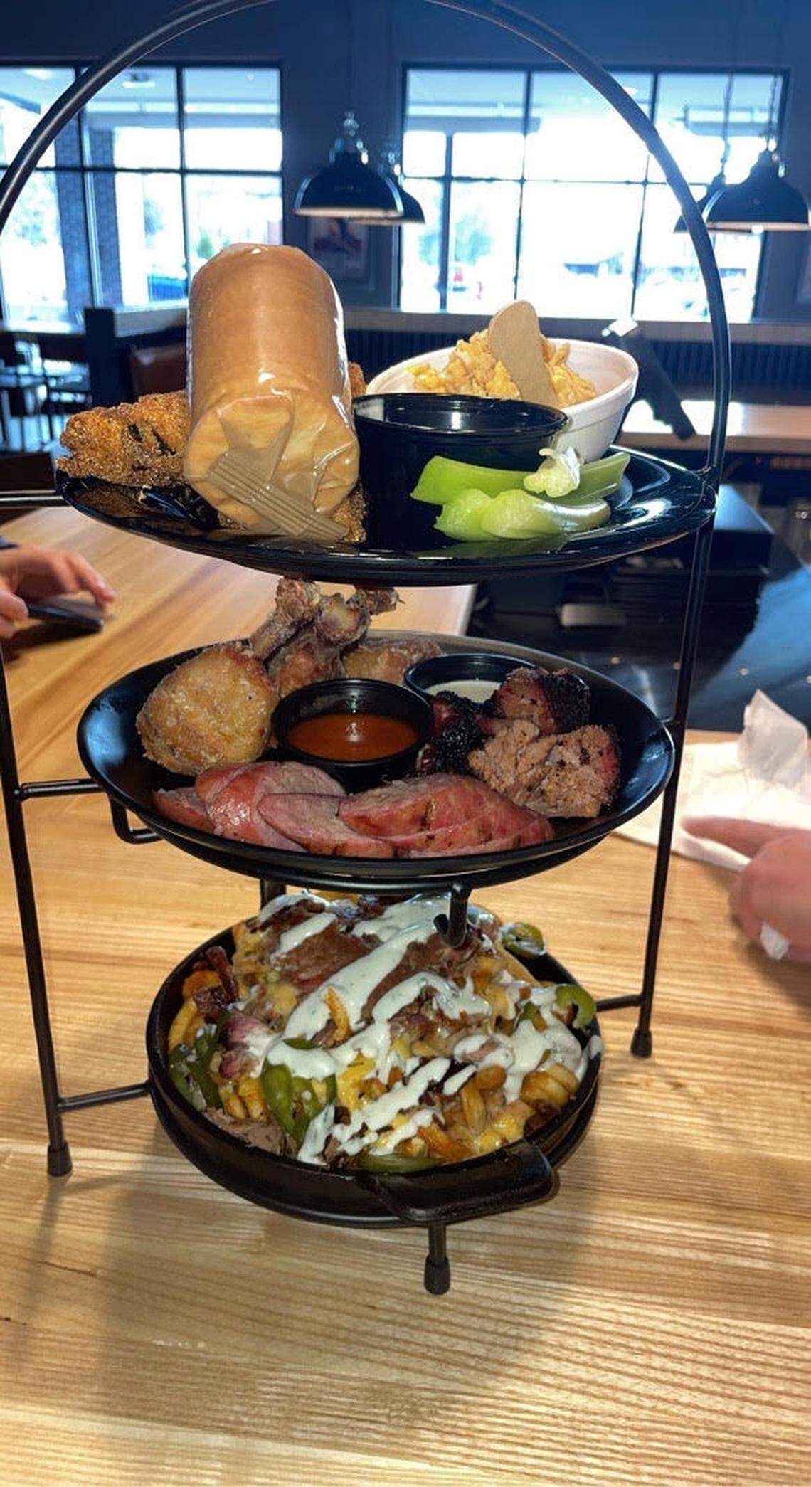 The Meat Tower is Meat Mitch’s riff on seafood towers, with a three-layer stack of meats.