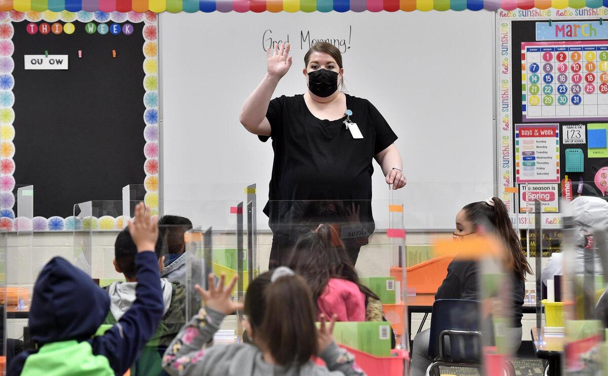 First grade teacher Marion Heck asks students a question. Students arrived at Douglass Elementary School in Kansas City, Kansas, Wednesday, March 31, 2021, for the first day of full in-person learning. According to Principal Louis Neal, about 75 percent of students are coming back for in-person learning.