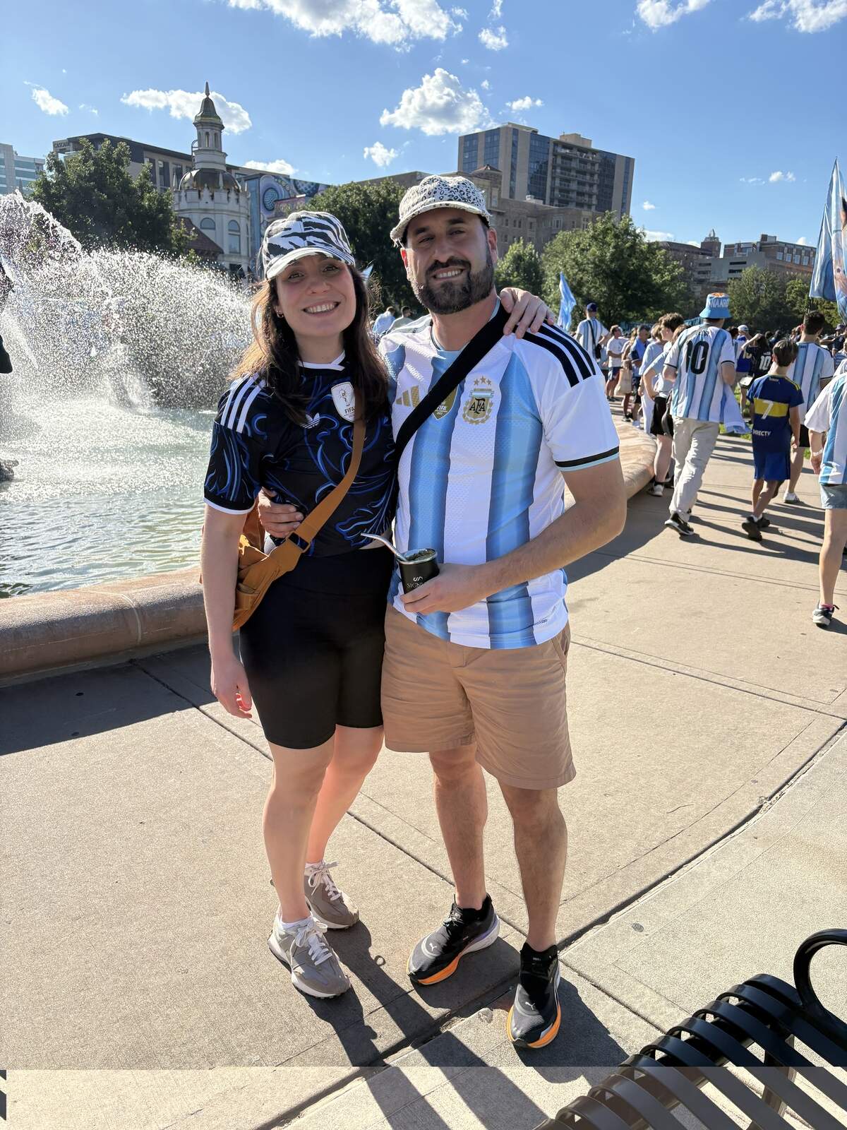 Karina Stickar and Natael Vera of Argentina’s Neuquén province pose in front of the Mill Creek Park fountain in Kansas City.