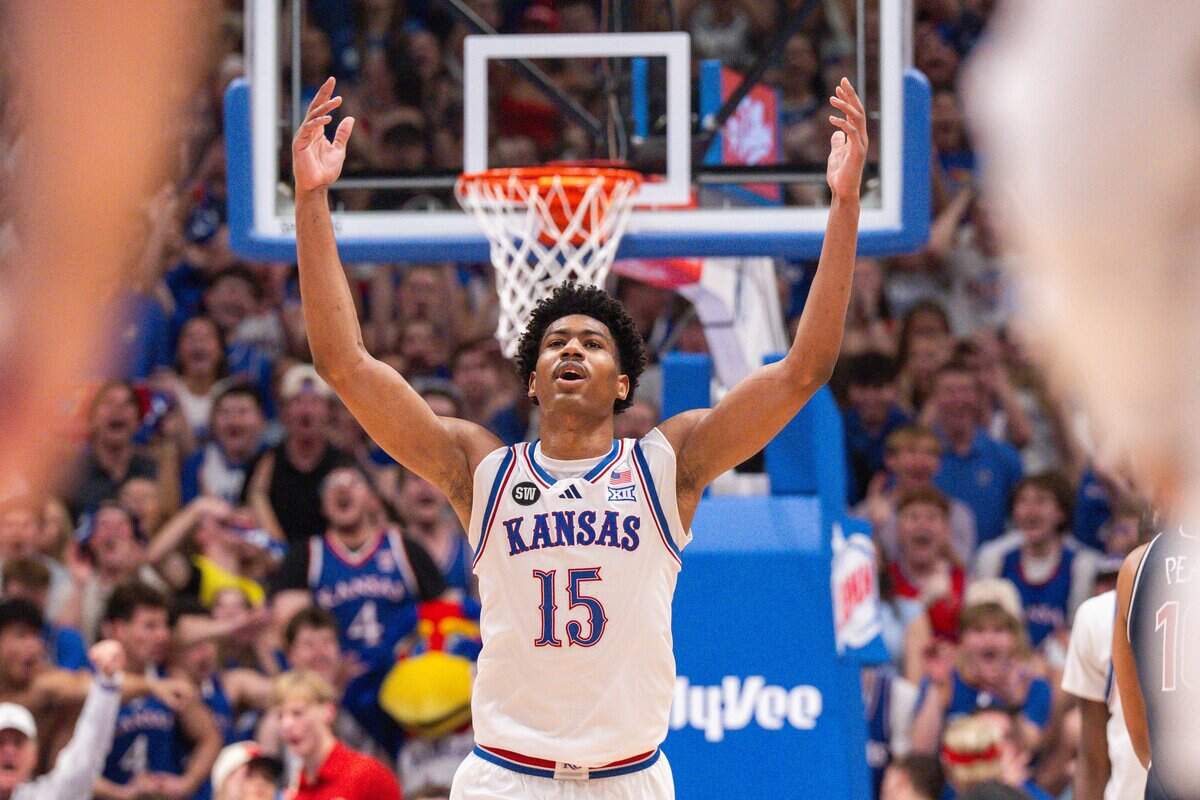 Kansas Jayhawks forward Bryson Tiller (15) raises his hands in celebration late in the second half vs. the Arizona Wildcats on Monday, February 9, 2026, at Allen Fieldhouse.