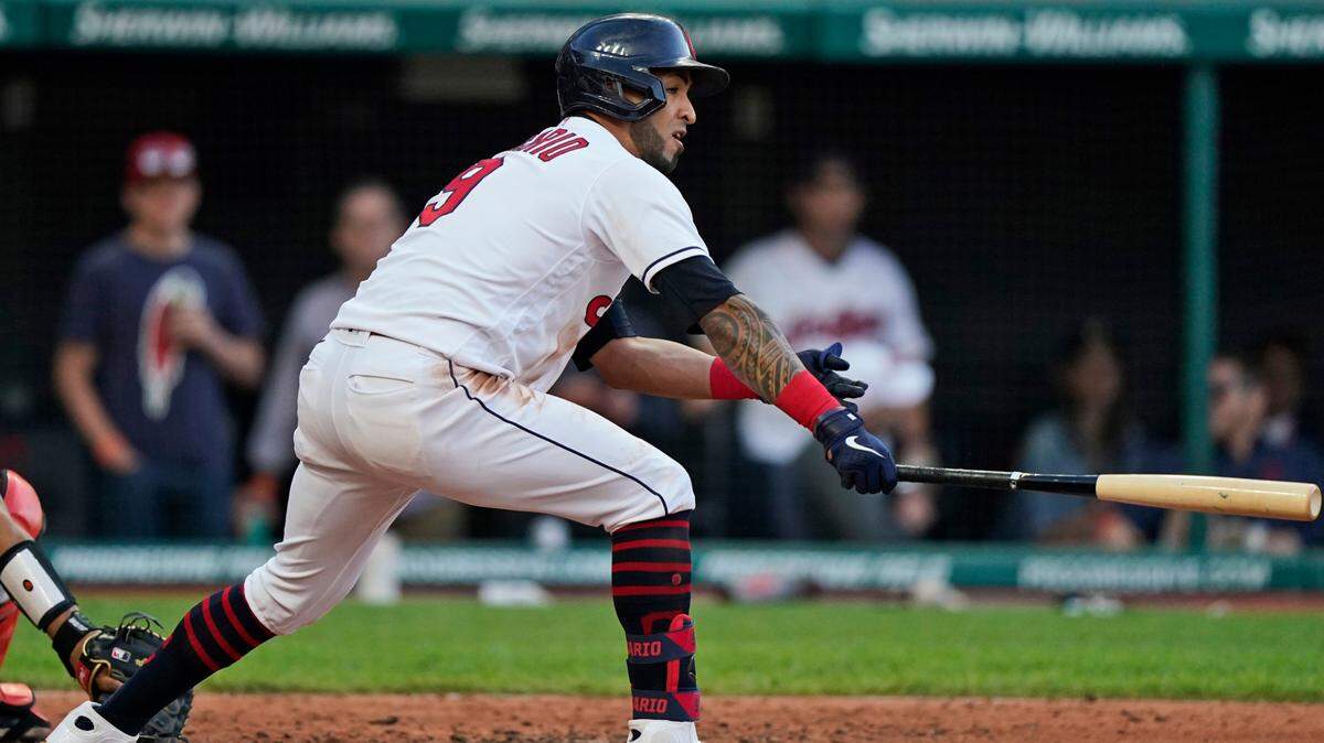 Cleveland Indians’ Eddie Rosario watches his RBI double in the third inning of the team’s baseball game against the Baltimore Orioles, Wednesday, June 16, 2021, in Cleveland. (AP Photo/Tony Dejak)