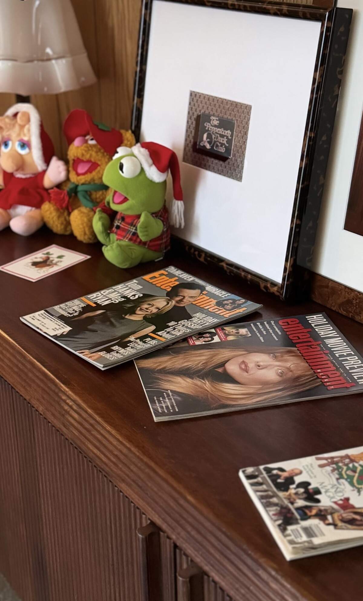 A trio of Muppets and old issues of entertainment magazines greeted guests at the front door.
