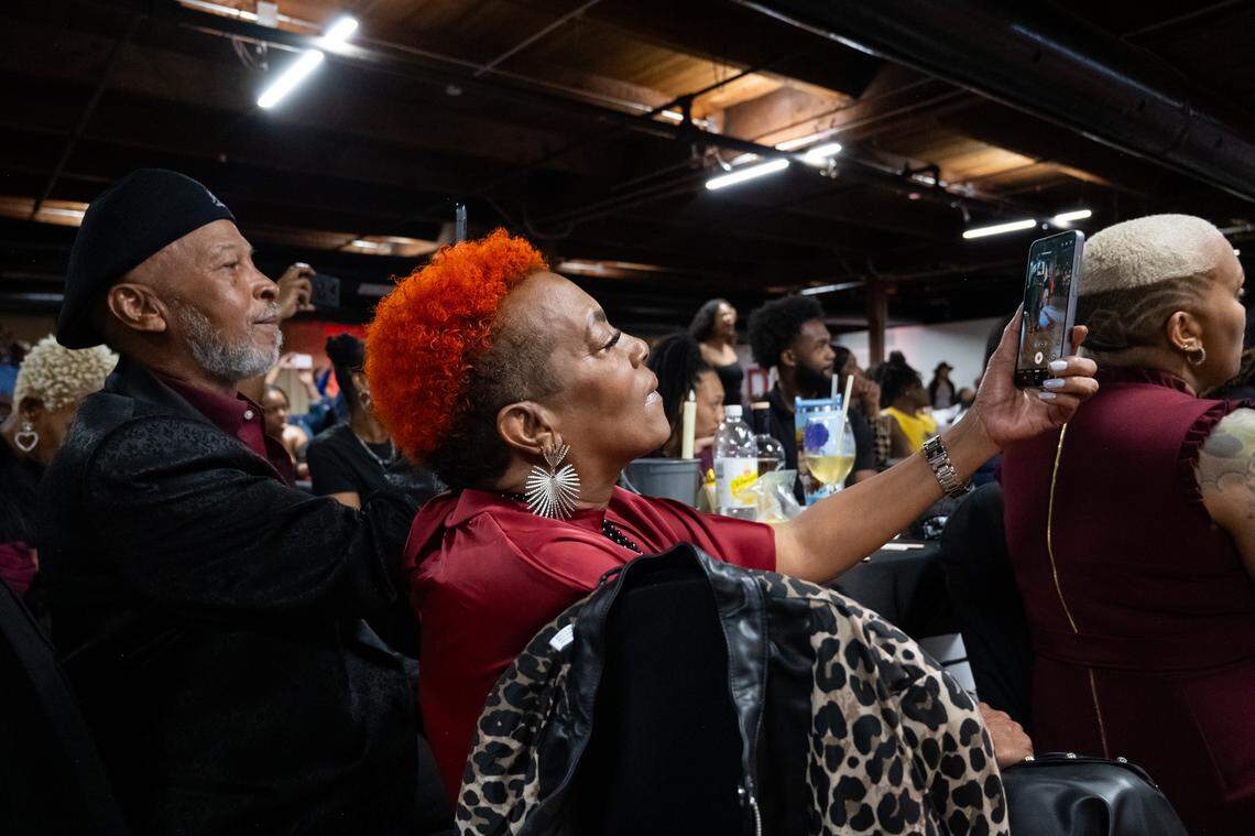 Teresa Herring takes a photo of couples performing a warm-up routine at The Big StepOff 2025, held on Oct. 18, 2025, in Kansas City. Many two-step groups attended the event, including FLOSS KC, Steppers of KC, IDWD, and Stepp-tacula.