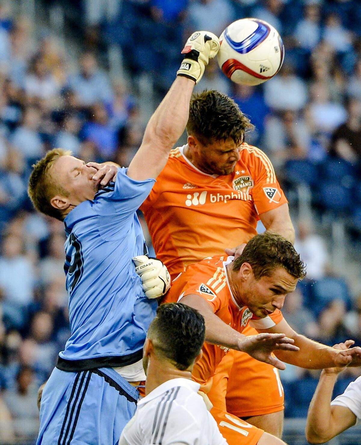 Almost immediately, plays like this one by Sporting Kansas City goal keeper Tim Melia (at left, knocking away a ball against the Houston Dynamo in 2015) endeared him to KC fans ... and manager Peter Vermes.