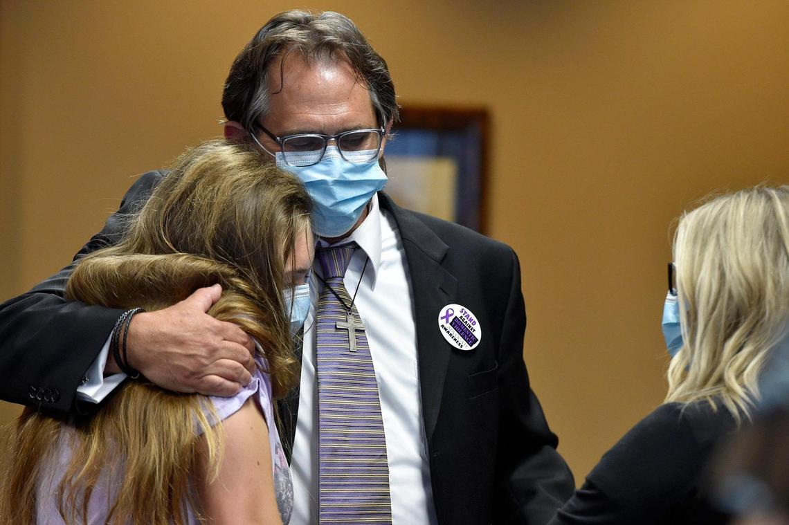 Bo Tucker and Anna Tucker, the brother and niece of Tamara Tucker, embrace at then end of a press conference. Tamara Tucker was killed by her intimate partner aboard a cruise ship in 2018. Eric Newman of Topeka was sentenced to 12 years in federal prison Wednesday, July 8, 2020, at the Robert J. Dole Federal Courthouse for second degree murder in the killing of Tucker. The family is working to create a nationwide registry of domestic violence offenders.