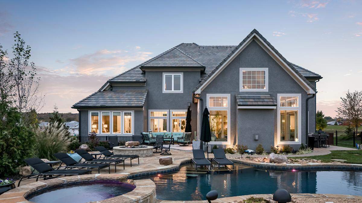 Available now! This newer, award-winning 1½-story home by Don Julian Builders is located on the Tom Watson Signature Course.