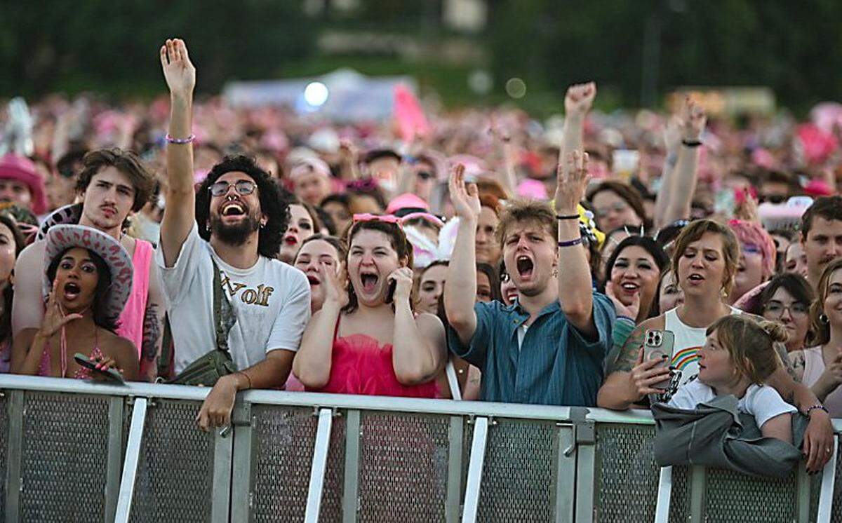 Fan cheer on the opening acts at the Chappell Roan concert on Saturday, Oct. 4, 2025, at the National WWI Museum and Memorial in Kansas City.