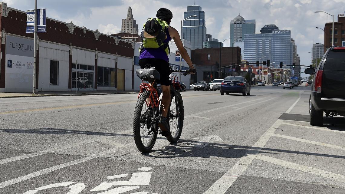 A cyclist uses the bicycle lane northbound on Grand Boulevard near 20th Street.