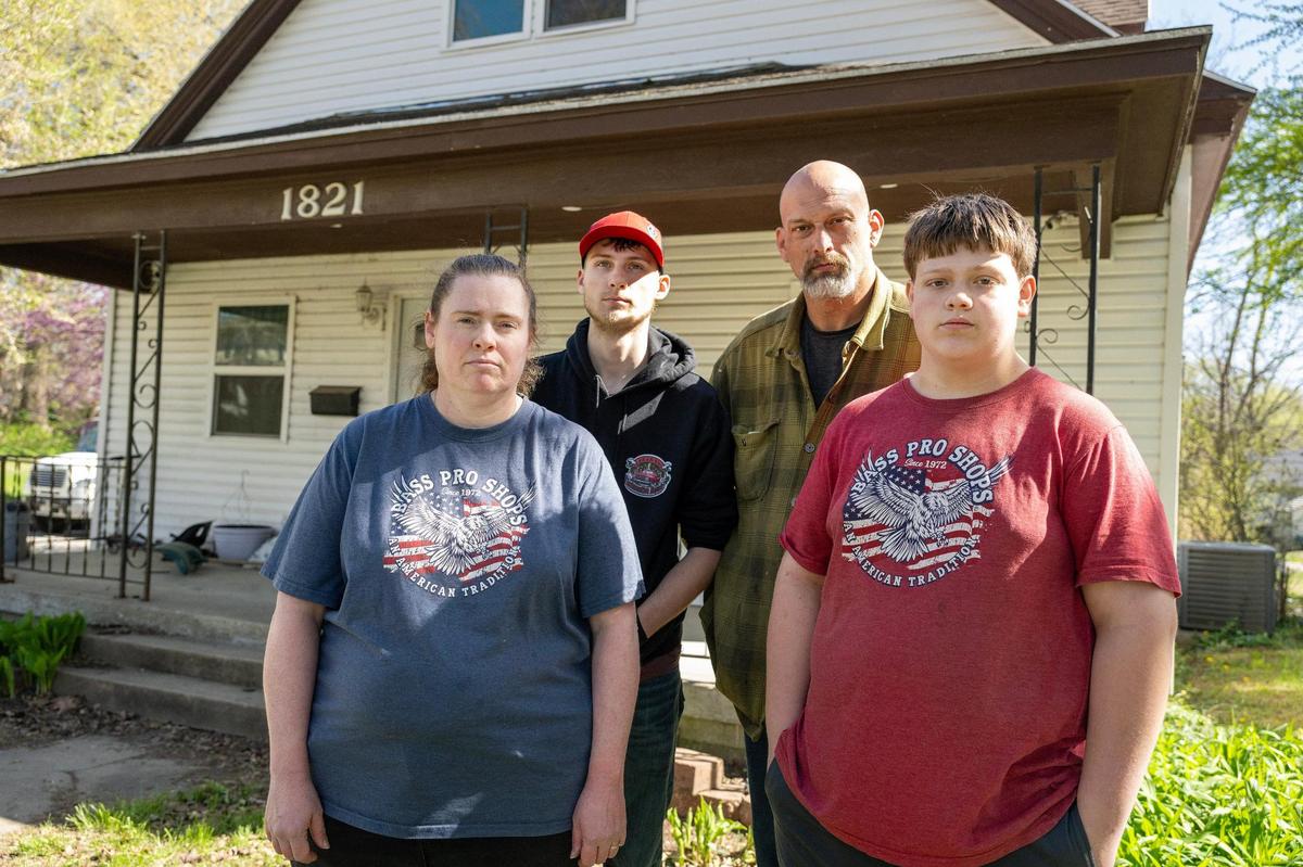 Jacob Peckham stands with his wife, Heather, and their sons, Daniel, 17, and Luke, 14, for a portrait in front of their home on Tuesday, April 15, 2025, in Lexington, Missouri.