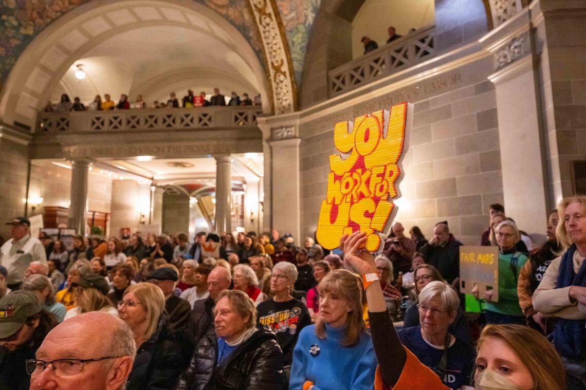 Protesters hold signs in the Missouri State Capitol rotunda on Wednesday, January 21, 2026 in Jefferson City. Organizations and allies gathered to protest recent Missouri lawmaker's decisions.
