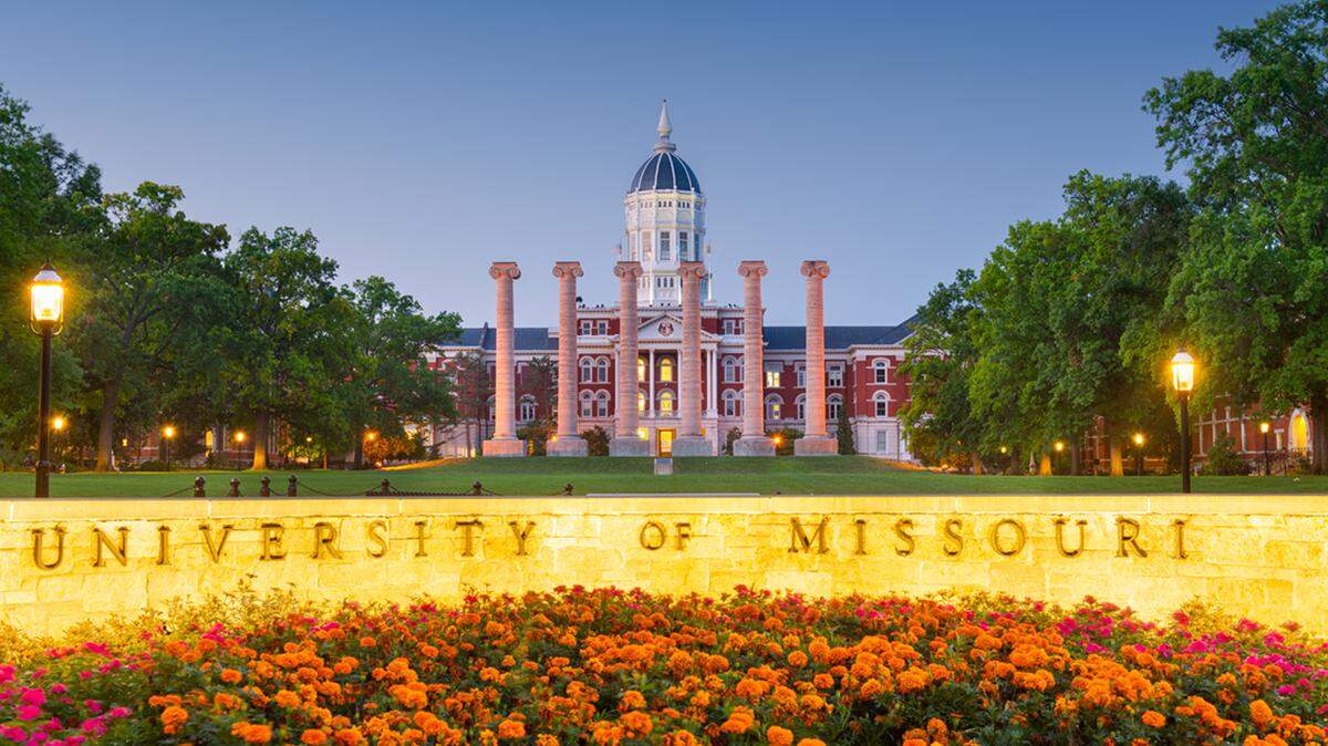 The University of Missouri campus and main sign at Francis Quadrangle in Columbia during twilight.