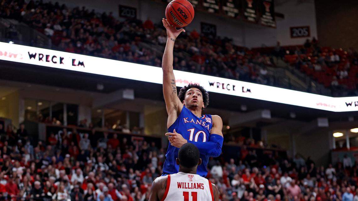 Kansas’ Jalen Wilson (10) shoots the ball over Texas Tech’s Bryson Williams (11) during the second half of an NCAA college basketball game Saturday, Jan. 8, 2022, in Lubbock, Texas. (AP Photo/Brad Tollefson)