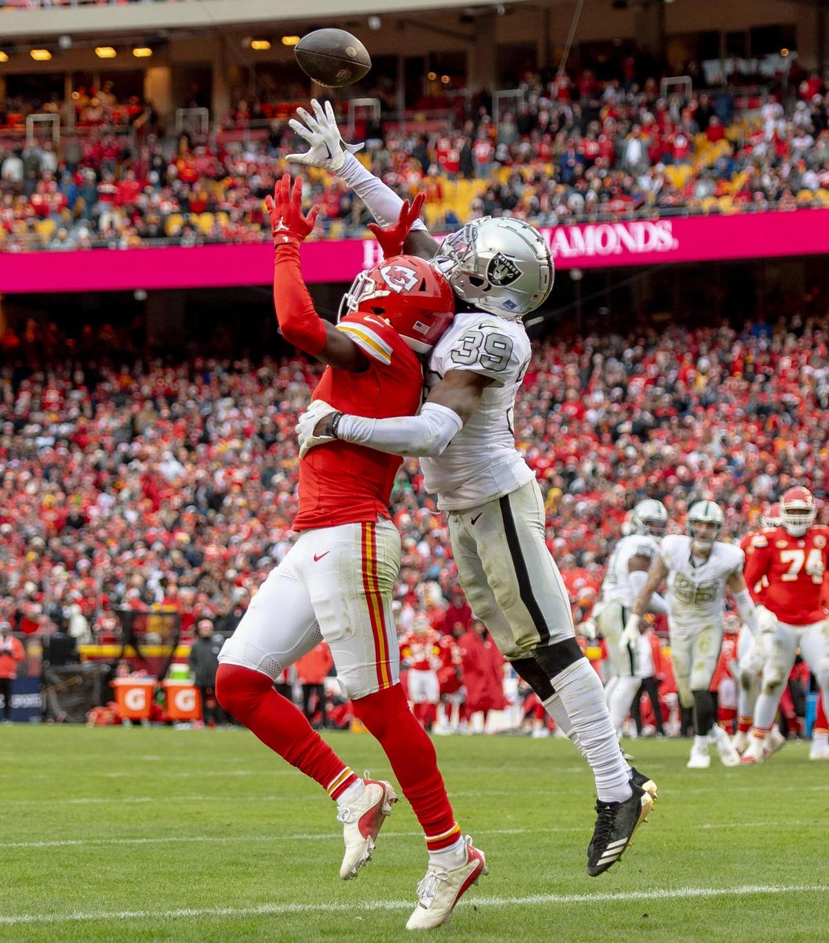 Las Vegas Raiders cornerback Nate Hobbs (39) breaks up a pass intended for Kansas City Chiefs wide receiver Rashee Rice (4) during an NFL football game on Monday, Dec. 25, 2023, at Arrowhead Stadium at GEHA Field in Kansas City.