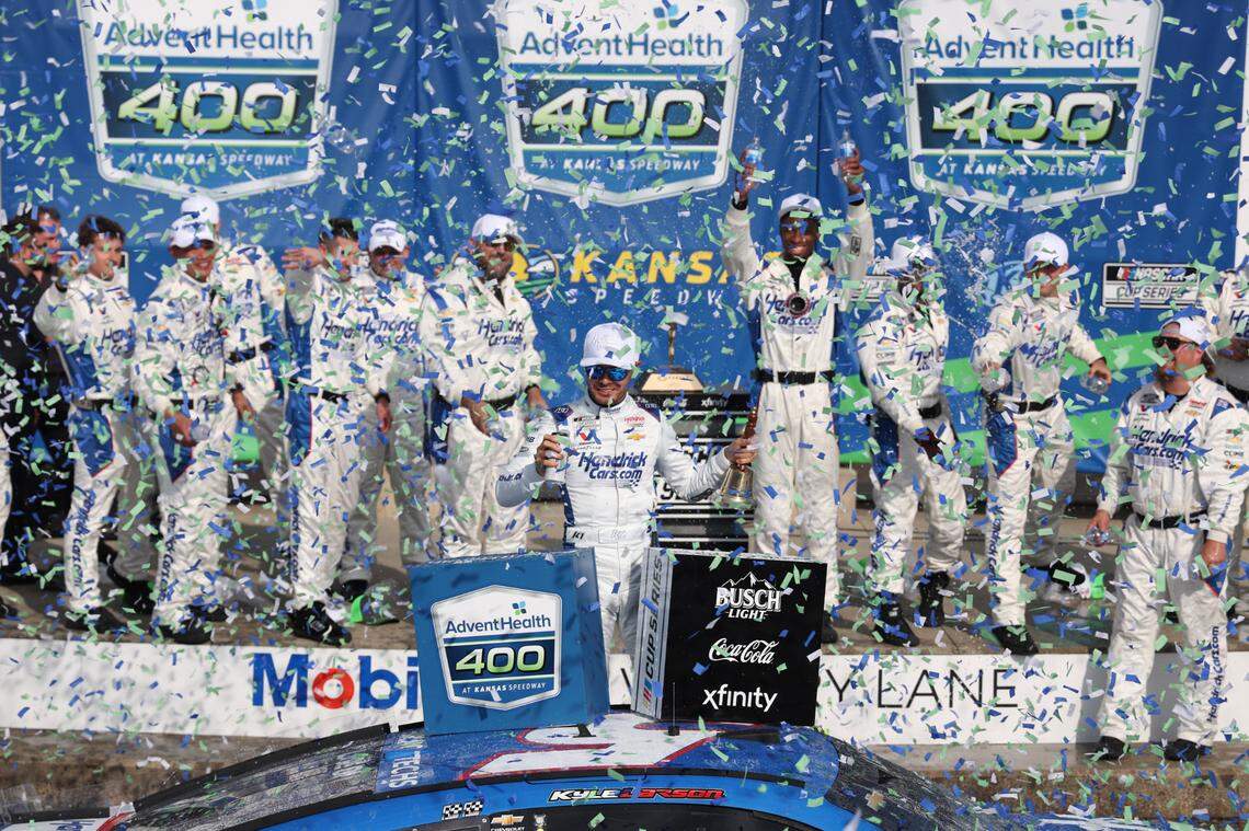 NASCAR Cup Series driver Kyle Larson, center, celebrates his Sunday, May 11, 2025 win in the AdventHealth 400 race at Kansas Speedway in Kansas City, Kan.