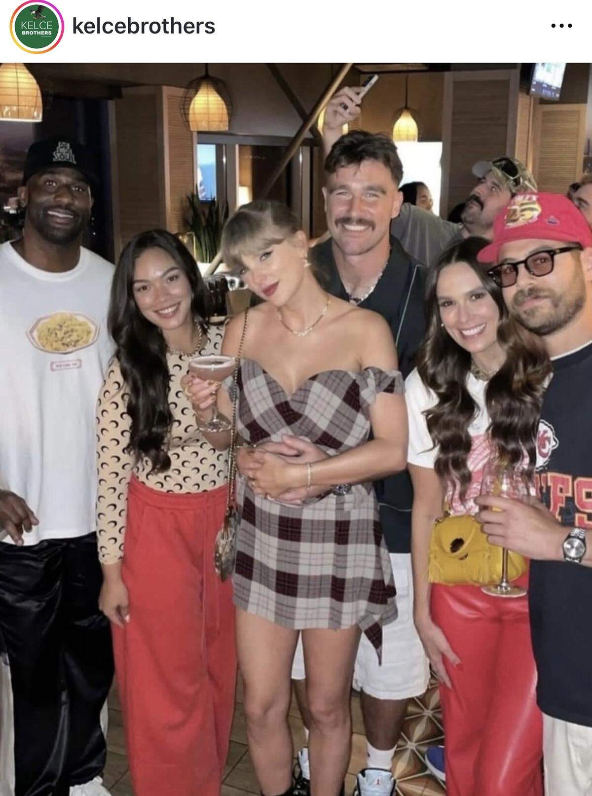 The Kelce Brothers Instagram account posted a photo of Taylor Swift and Travis Kelce with friends after the Chiefs-Saints game. They appear to be at one of the couple’s favorite restaurants in Kansas City, Prime Social.