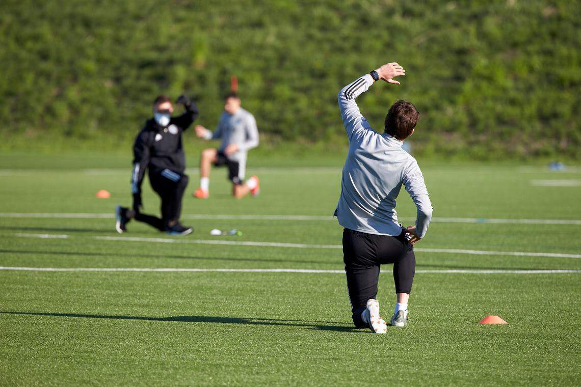 Matt Besler and a few teammates employed some league-mandated social distancing during a midweek visit to Sporting KC’s Pinnacle training facility in Kansas City, Kan.