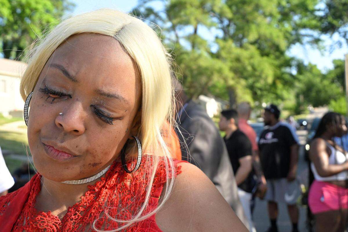 Nikkia Manning still had blood on her face after giving her son, Nikko Manning, 22, CPR following a shooting early Sunday, June 25, 2023, near 57th Street and Prospect Avenue in Kansas City. Manning’s son was one of three people who died from the shooting. “He was just in the wrong place at the wrong time,” Nikkia Manning said. “It happened so fast. I just can’t believe it.”