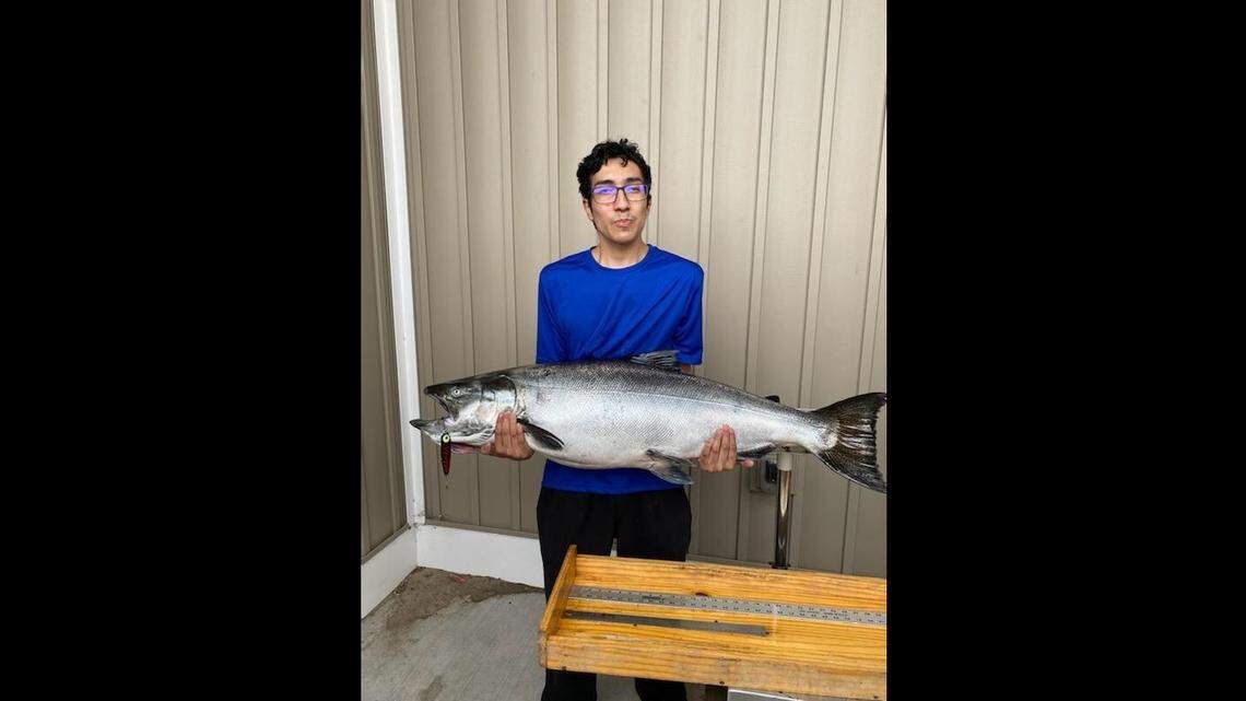Luis Martinez, 19, reeled in a nearly 48-pound chinook salmon, setting a new state record in Michigan.