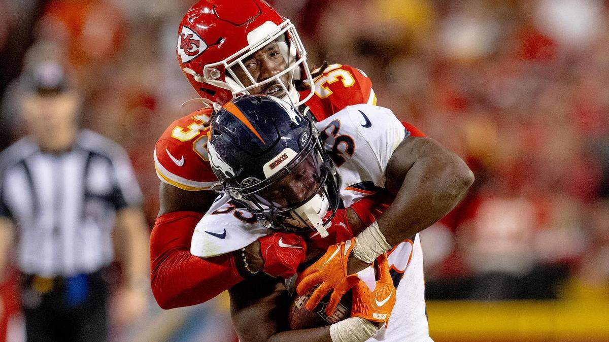 Kansas City Chiefs cornerback L’Jarius Sneed (38) tackles Denver Broncos running back Javonte Williams (33) during an NFL football game at GEHA Field at Arrowhead Stadium on Thursday, Oct. 12, 2023, in Kansas City.