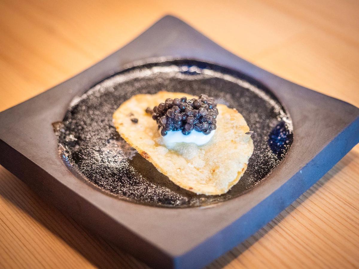 A classic “high-low” potato chip with caviar, served between courses at Sushi Kodawari.